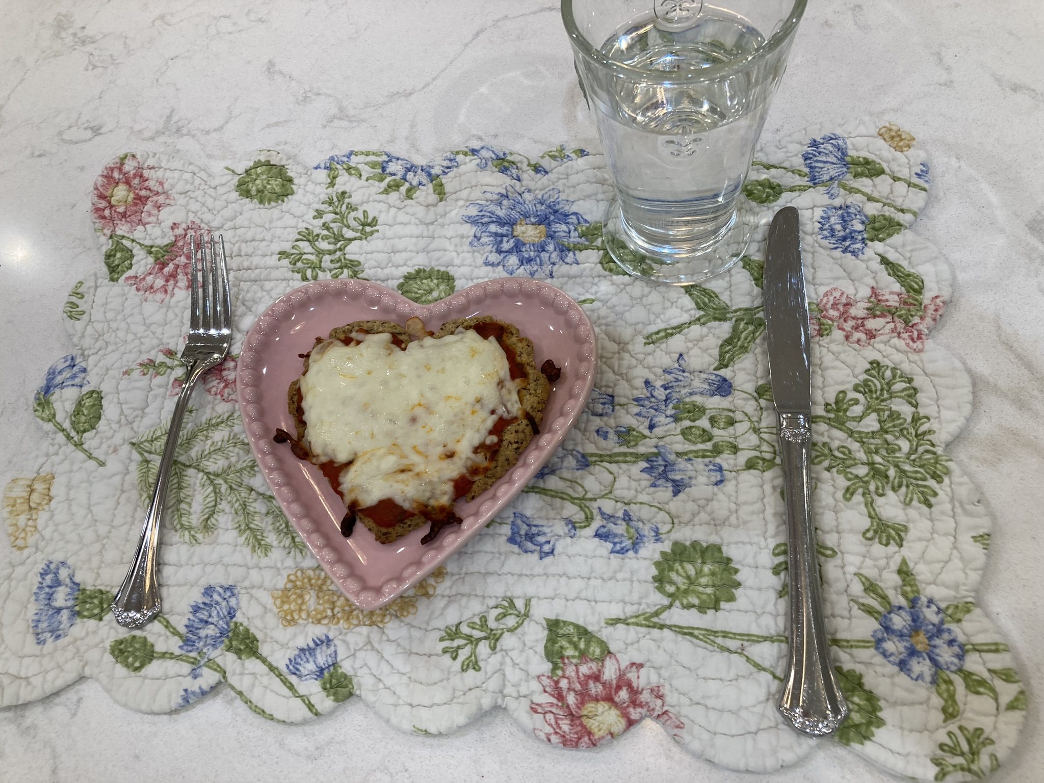 mini heart pizza on placemat