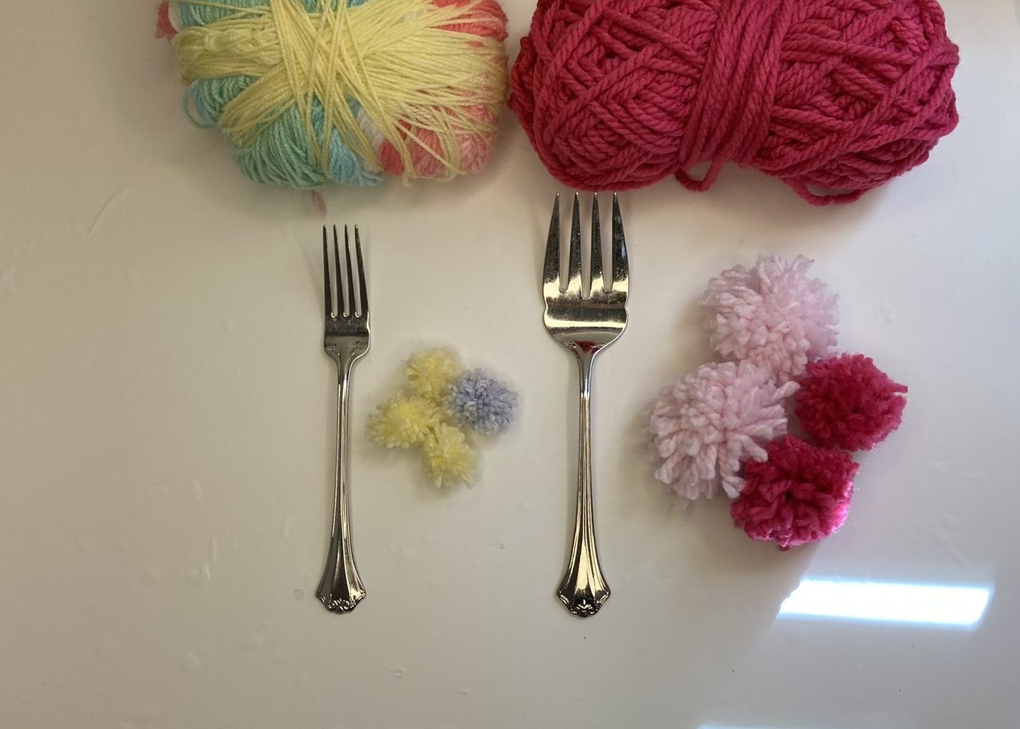 large and small fork pom pom